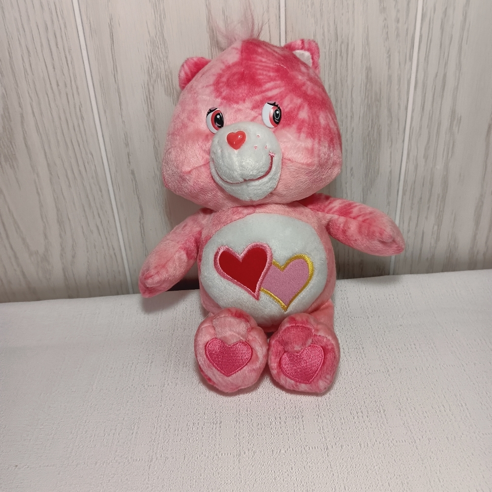 2003 TCFC Care Bears Love-A-Lot Bear pink tie dye pattern plush stuffed animal.